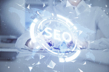 Multi exposure of woman's hands making notes with SEO icon. Concept of Search engine optimization