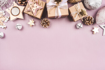 Festive Christmas background with different size gift boxes and Christmas decorations. Top view. Copy space for text.