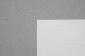 white paper on gray cardboard background