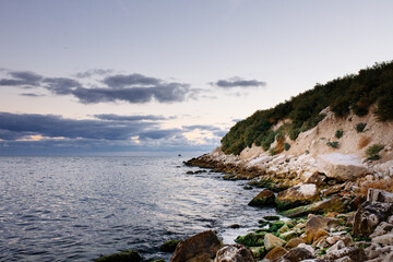 Kavarna, Bulgaria - September 2 2016: Sunrise on the Bulgarian, stony, green overgrown Black Sea coast