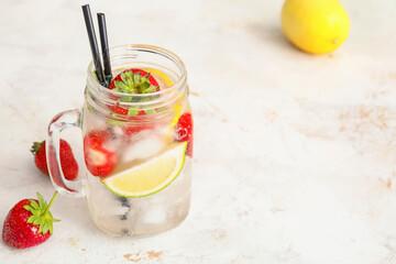 Jar of fresh strawberry lemonade on light table