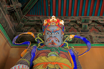 The Buddha statue is worshipped in the Mahavira hall in a temple, Yi County, Hebei Province, China