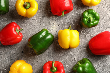 Fresh bell peppers on textured background