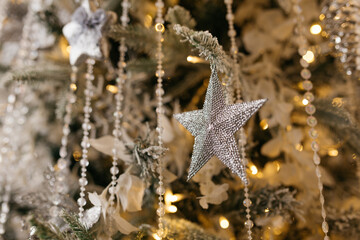 Christmas tree decoration: Christmas glass toys, flickering garlands. concept: an example of the...