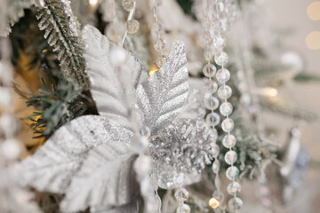 Christmas tree decoration: Christmas glass toys, flickering garlands. concept: an example of the...