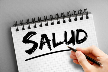 Text note - Salud (Health in Spanish), concept on notepad