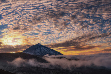 mountain landscape with clouds and sunset warm colors