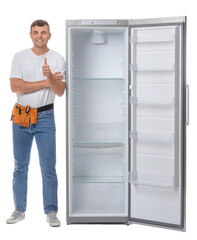 Worker of repair service showing thumb-up near fridge on white background