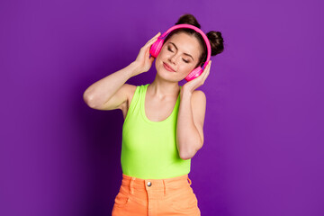Portrait of attractive dreamy peaceful cheery girl meloman listening hit jazz single genre isolated on bright violet color background