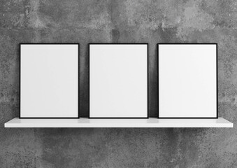 Vertical black frame mockup. Black frame poster on a white shelf with a concrete wall. 3D illustrations. 3 Frames Mockup