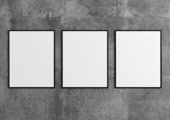 Three vertical black frame mockups. Black frame poster on a gray concrete wall. 3D illustrations.	