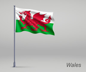 Waving flag of Wales - territory of United Kingdom on flagpole. Template for independence day poster design