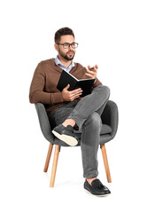 Male psychologist sitting in armchair on white background