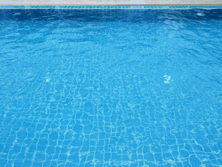 Fototapeta na wymiar blue swimming pool with water wave