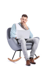 Male psychologist with laptop sitting in armchair on white background