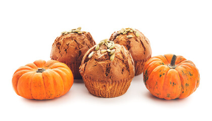 Tasty pumpkin muffins on white background