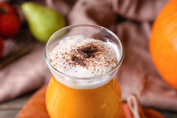 Glass of tasty pumpkin smoothie, closeup