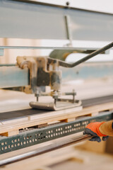 Vertical closeup shot of an industrial wood cutting machine