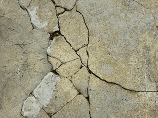 Cracked concrete texture closeup background