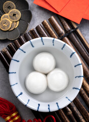 Top view of big tangyuan yuanxiao in a bowl on gray background for lunar new year food.