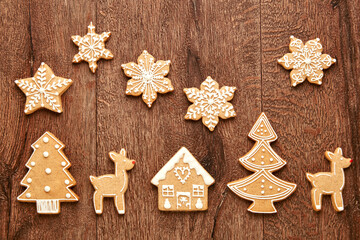 Gingerbread Christmas cookies viewed from above on a wooden background. Top view