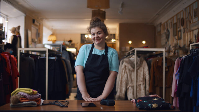 Portrait Of Female Smiling Owner Of Independent Clothing Store