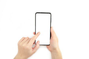 Woman hand holding the black smartphone with blank screen isolated on white background.