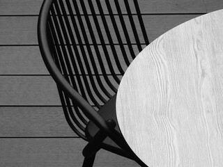 circular wooden table with metal chair on the wood floor, black and white style