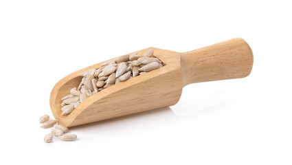 Shelled Sunflower Seeds in wood scoop on White Background