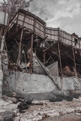 Boat, sea, stones sand, fog