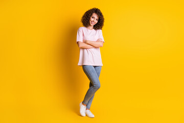Fototapeta na wymiar Full body photo of young pretty woman wear casual outfit successful folded arms isolated over yellow color background