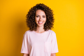 Photo of young positive cheerful curly hair girl happy smile isolated over yellow color background