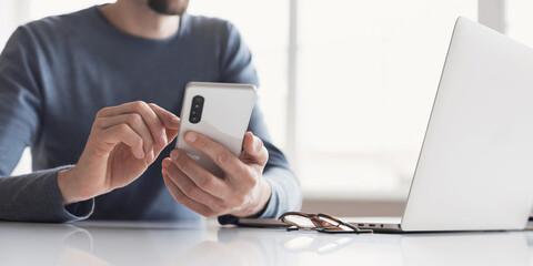 Young business man using phone panoramic banner, Communication, connection, business, people, technology concept, Closeup photo of male hands with smartphone