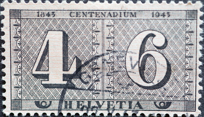 Switzerland - Circa 1943 : a postage stamp printed in the swiss showing two Swiss postal stamps...