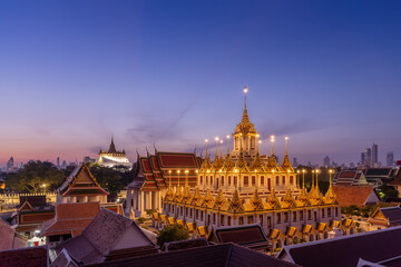Fototapeta na wymiar Loha Prasat or Iron Castle Monastery at Wat Ratchanatdaram temple, on Ratchadamnoen Avenue during morning, Bangkok, Thailand