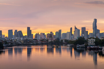 Obraz na płótnie Canvas Bangkok city center financial business district, waterfront cityscape and Chao Phraya River during twilight before sunrise, Thailand