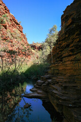 Hiking and swimming in Karijini National-Park, Western Australia with beautiful rock formations