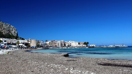 Fototapeta na wymiar Mondello, Sicily, evocative image of the beach with clear water and a beautiful blue sky