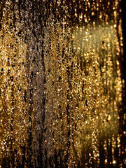 water drop on glass of window after rain with gold light at morning