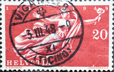 Switzerland - Circa 1948 : a postage stamp printed in the swiss showing Helvetia the Swiss goddess with a torch. Text: State centenary