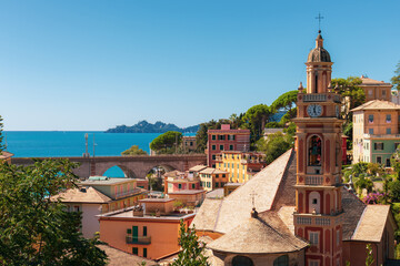 Fototapeta na wymiar High angle view of the town of Zoagli, Italy. In the background the promontory of Portofino