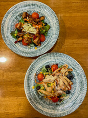 Caesar salad with chicken in a bright plate
