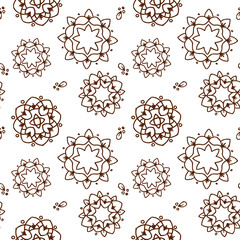 Ethnic brown mandala or snowflakes seamless pattern
