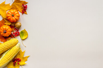 Thanksgiving autumn flat lay background with leaves and pumpkins
