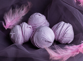 Blackcurrant marshmallows on a dark background.