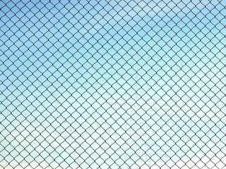 Decorative wire mesh of fence isolated on blue sky background