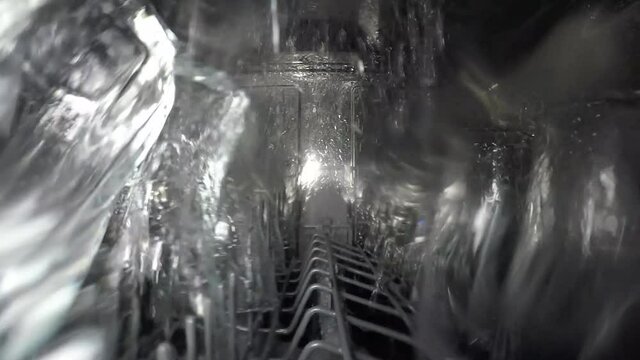 Dishes in the dishwasher. Inside view.
