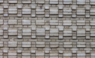 Bricks texture. A mosaic of bricks on the wall of a residential building. Background with place for text.