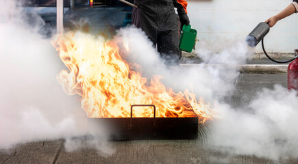 Man teaches or training how to use carbon dioxide  (CO2) fire extinguishers to extinguish fires...