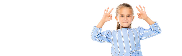 Smiling kid showing okay gesture isolated on white, banner
